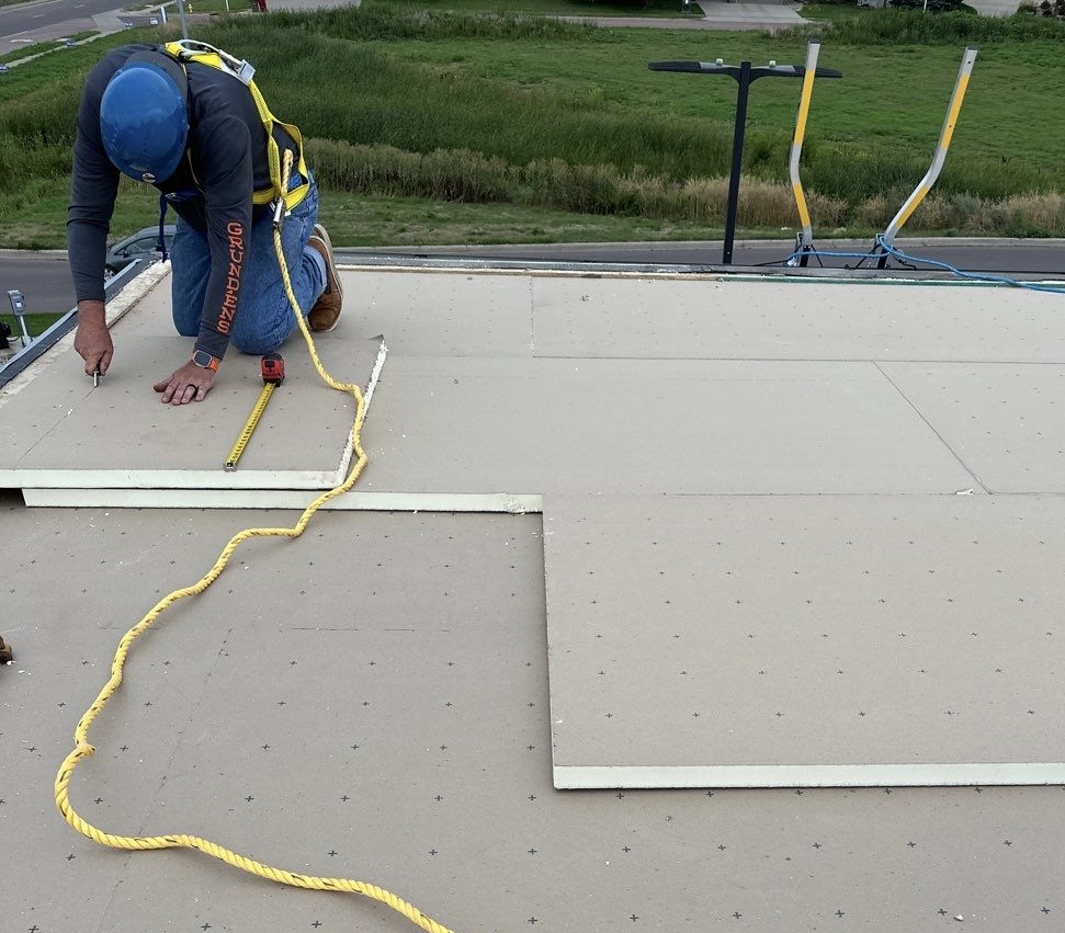 Roofer on Sioux Falls commercial roof